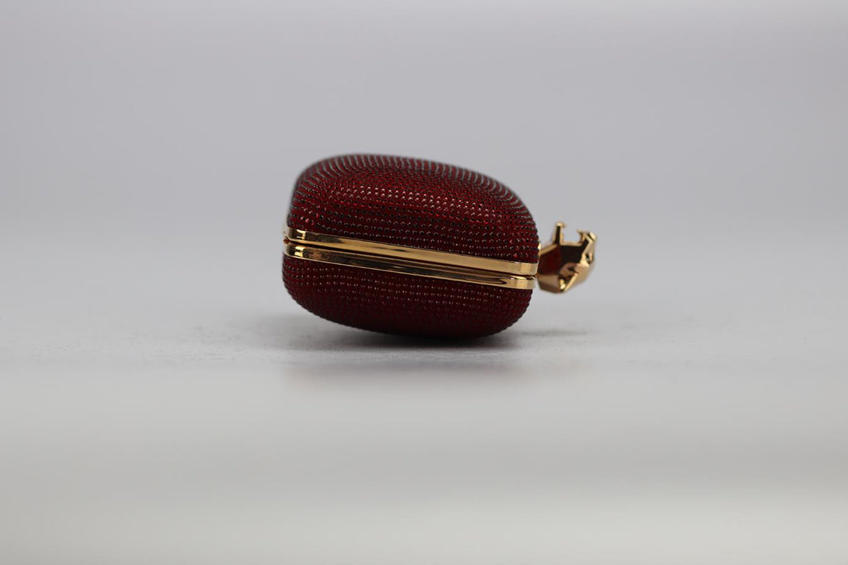 STARK CRYSTAL EMBELLISHED SUEDE AND ROSE GOLD TONE CLUTCH