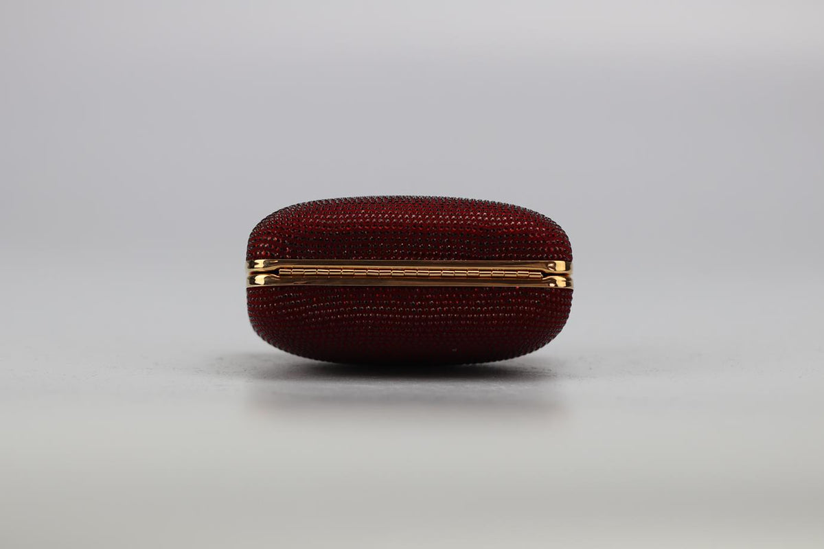STARK CRYSTAL EMBELLISHED SUEDE AND ROSE GOLD TONE CLUTCH