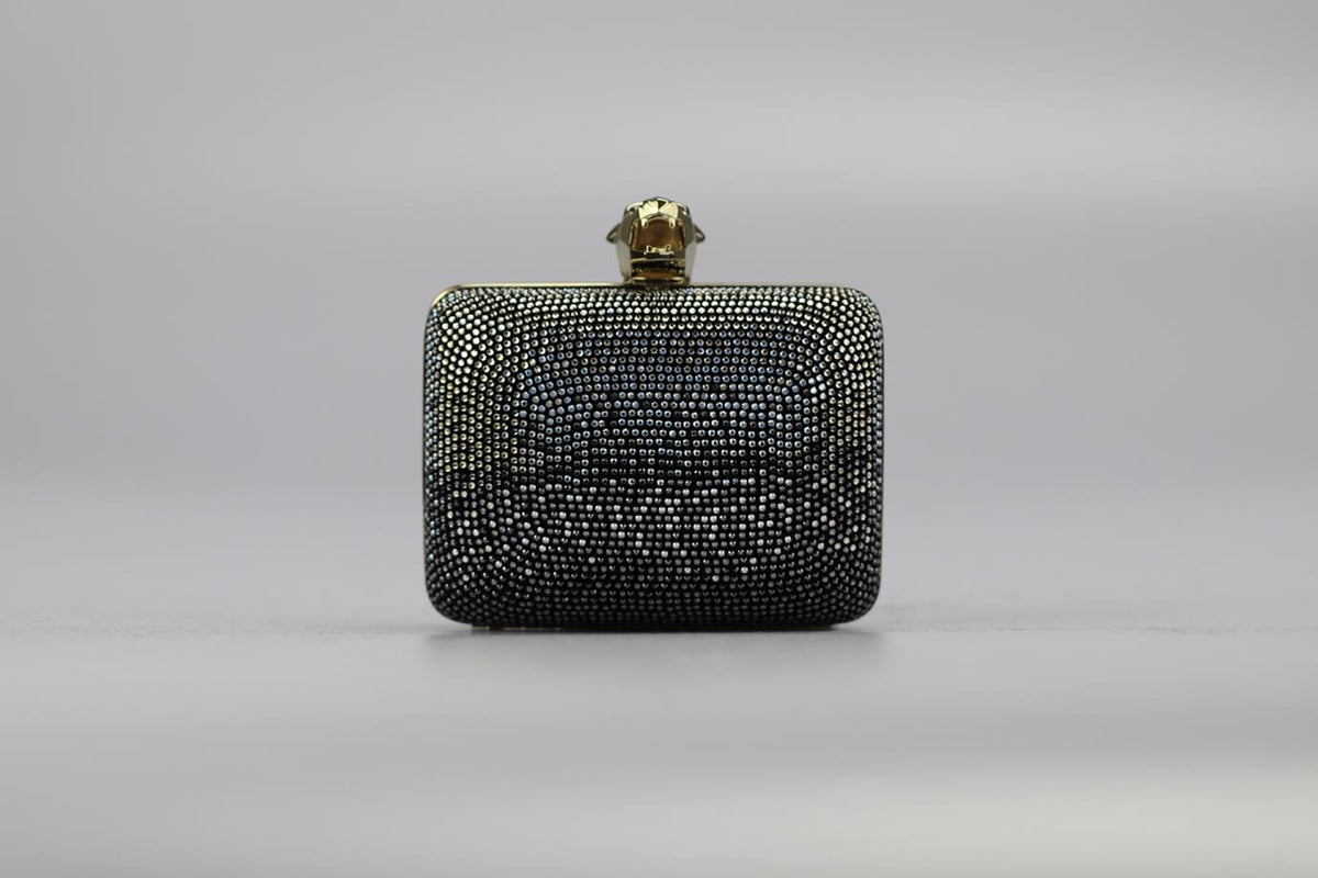 STARK CRYSTAL EMBELLISHED SUEDE AND SILVER TONE CLUTCH