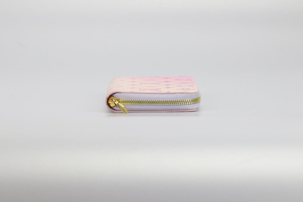 LOUIS VUITTON ZIPPY SPRING IN THE CITY MONOGRAM COATED CANVAS AND LEATHER WALLET