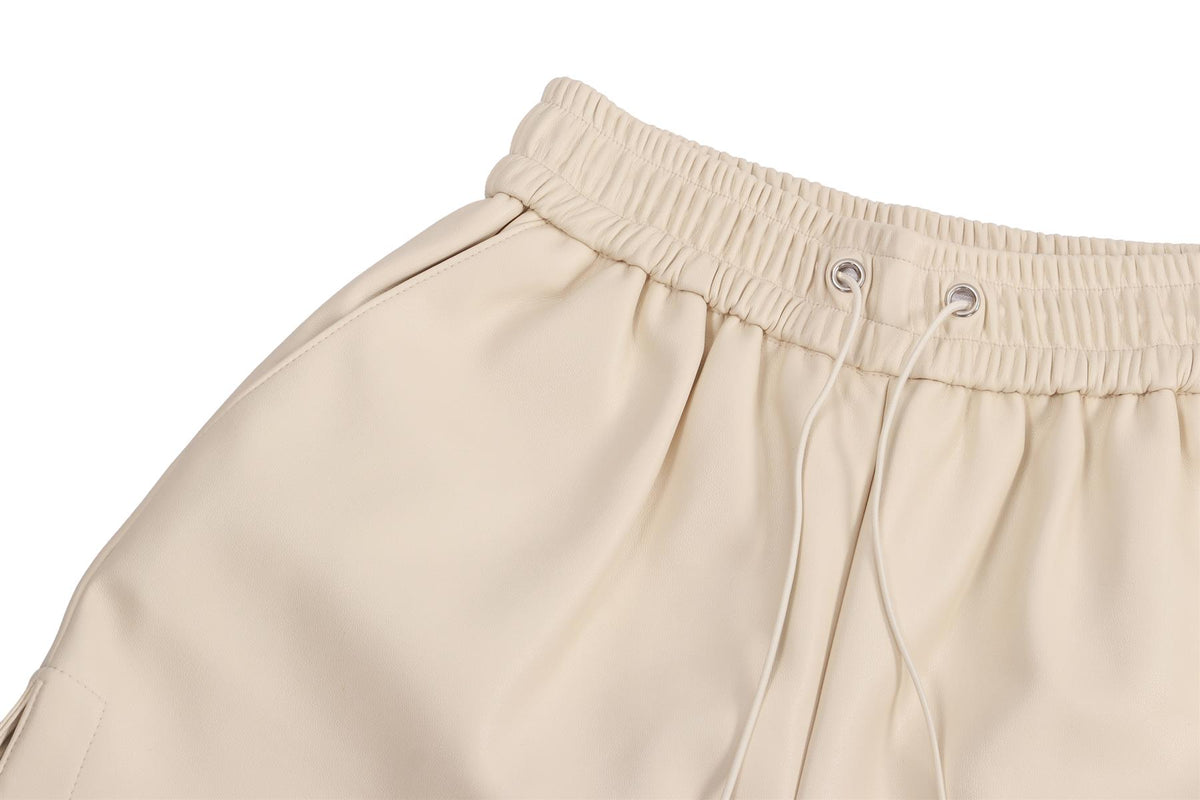 CREAM FAUX LEATHER SHORTS