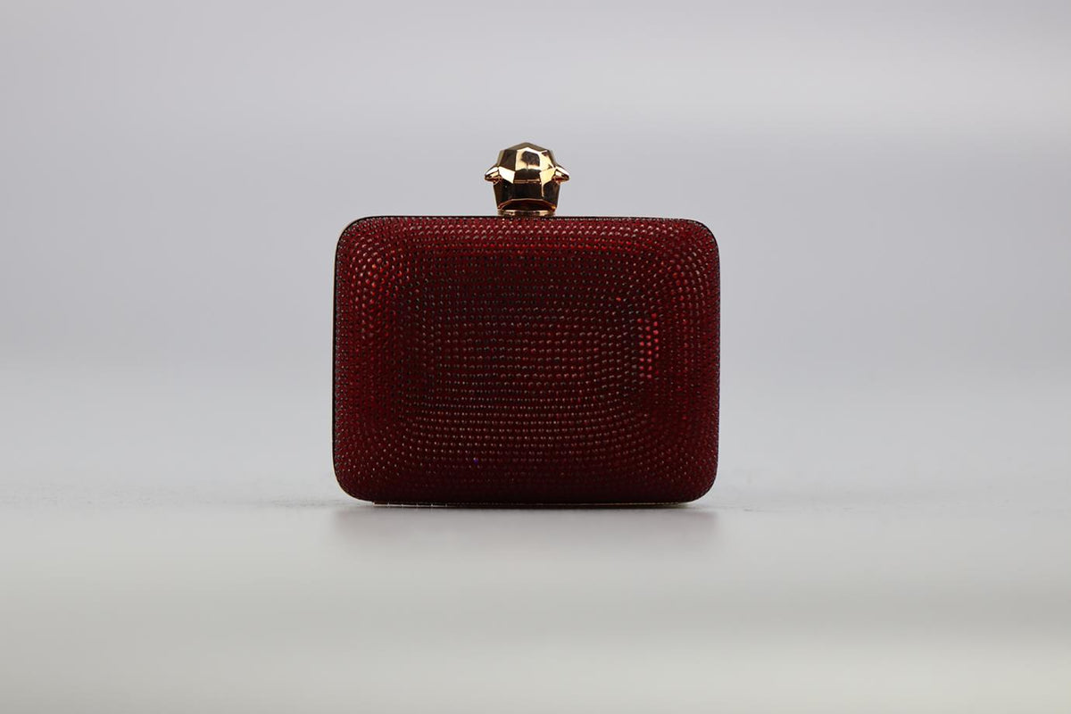 STARK CRYSTAL EMBELLISHED SUEDE AND ROSE GOLD TONE CLUTCH