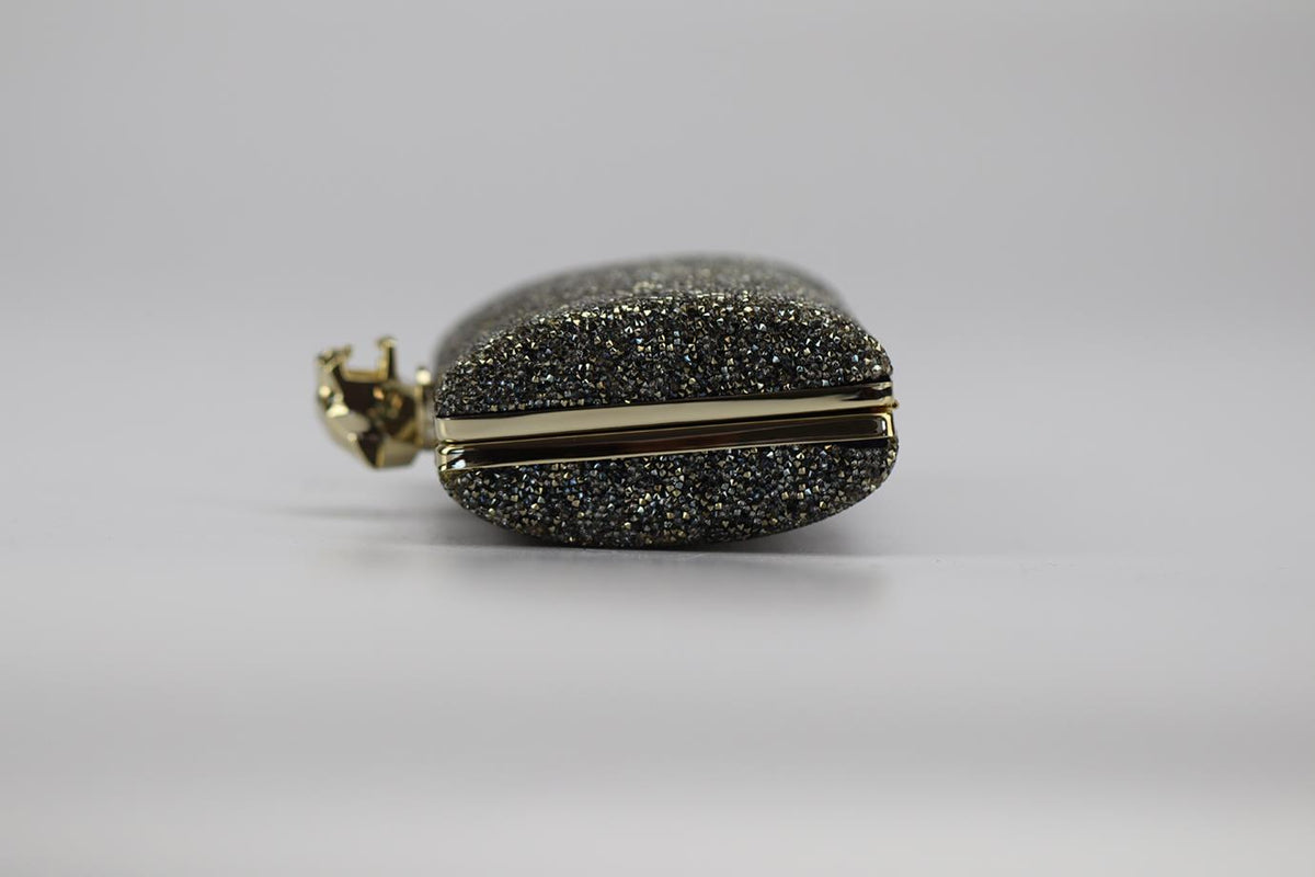 STARK CRYSTAL EMBELLISHED SUEDE AND SILVER TONE CLUTCH