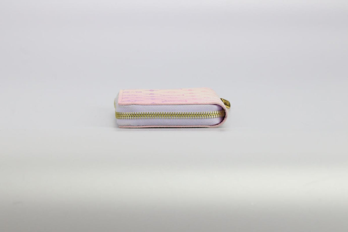 LOUIS VUITTON ZIPPY SPRING IN THE CITY MONOGRAM COATED CANVAS AND LEATHER WALLET