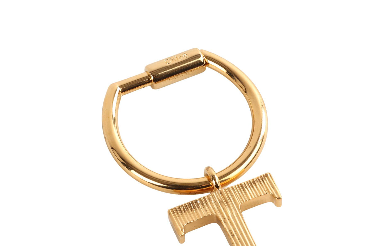 CHLOÉ T INITIAL GOLD TONE KEYCHAIN
