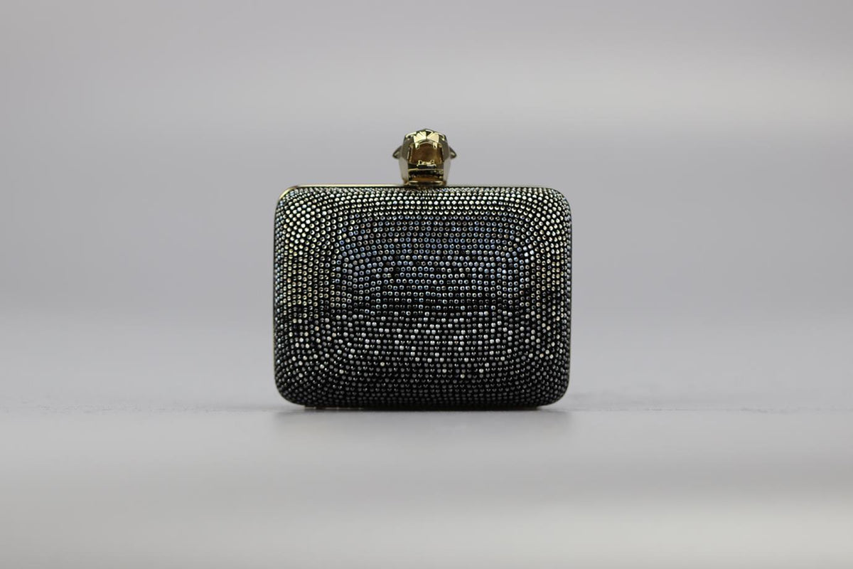 STARK CRYSTAL EMBELLISHED SUEDE AND SILVER TONE CLUTCH