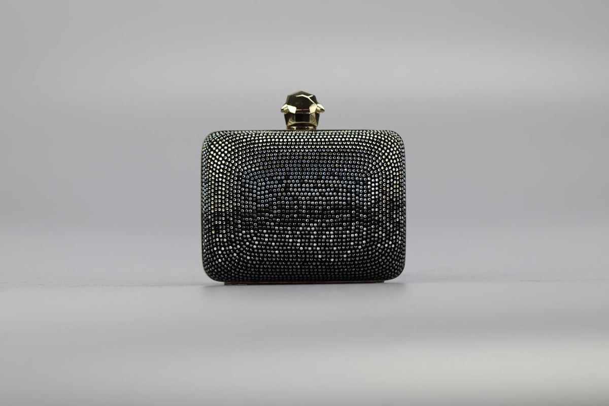 STARK CRYSTAL EMBELLISHED SUEDE AND SILVER TONE CLUTCH