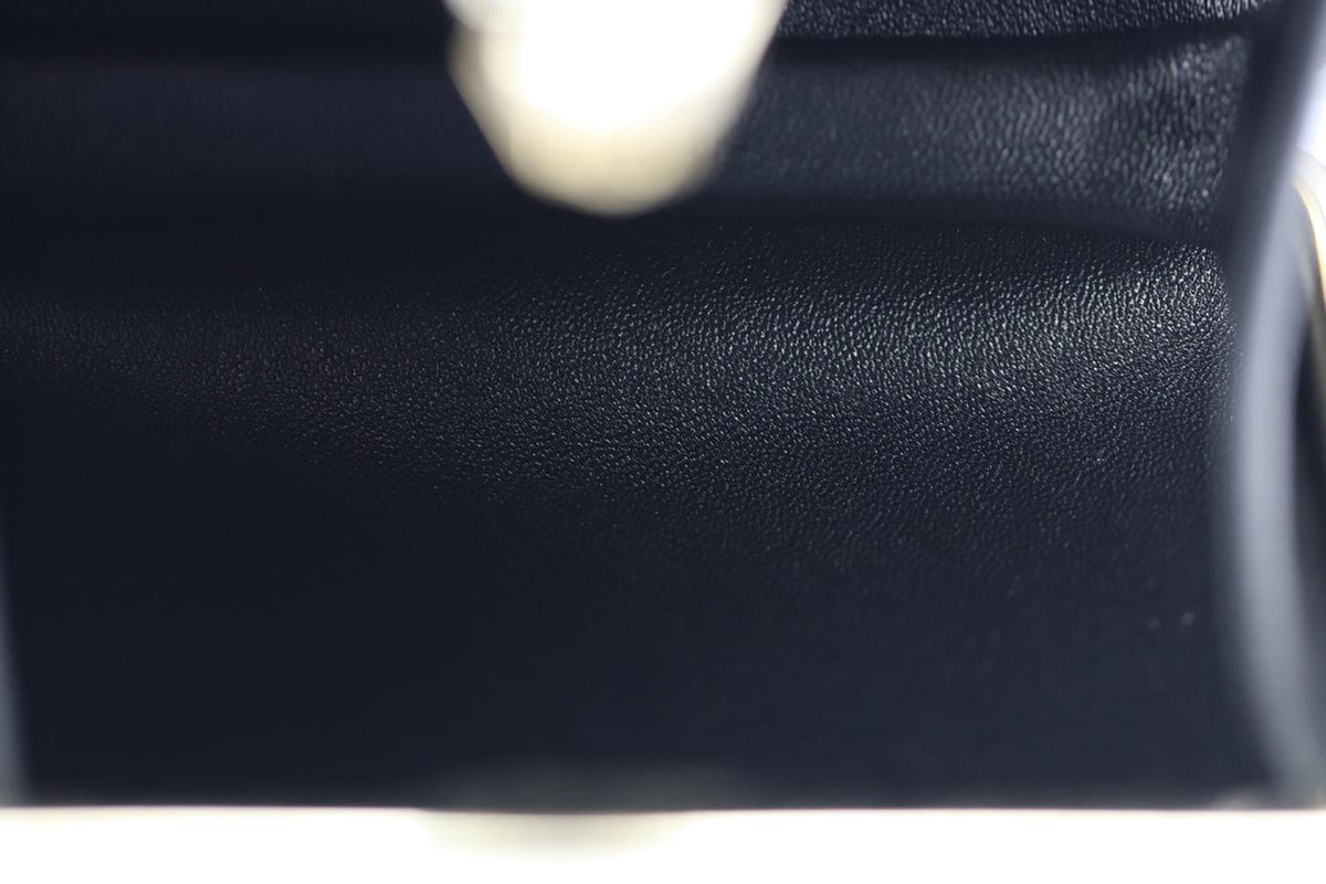 STARK CRYSTAL EMBELLISHED SUEDE AND SILVER TONE CLUTCH