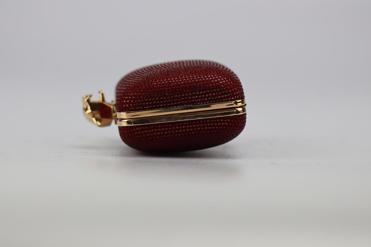 STARK CRYSTAL EMBELLISHED SUEDE AND ROSE GOLD TONE CLUTCH