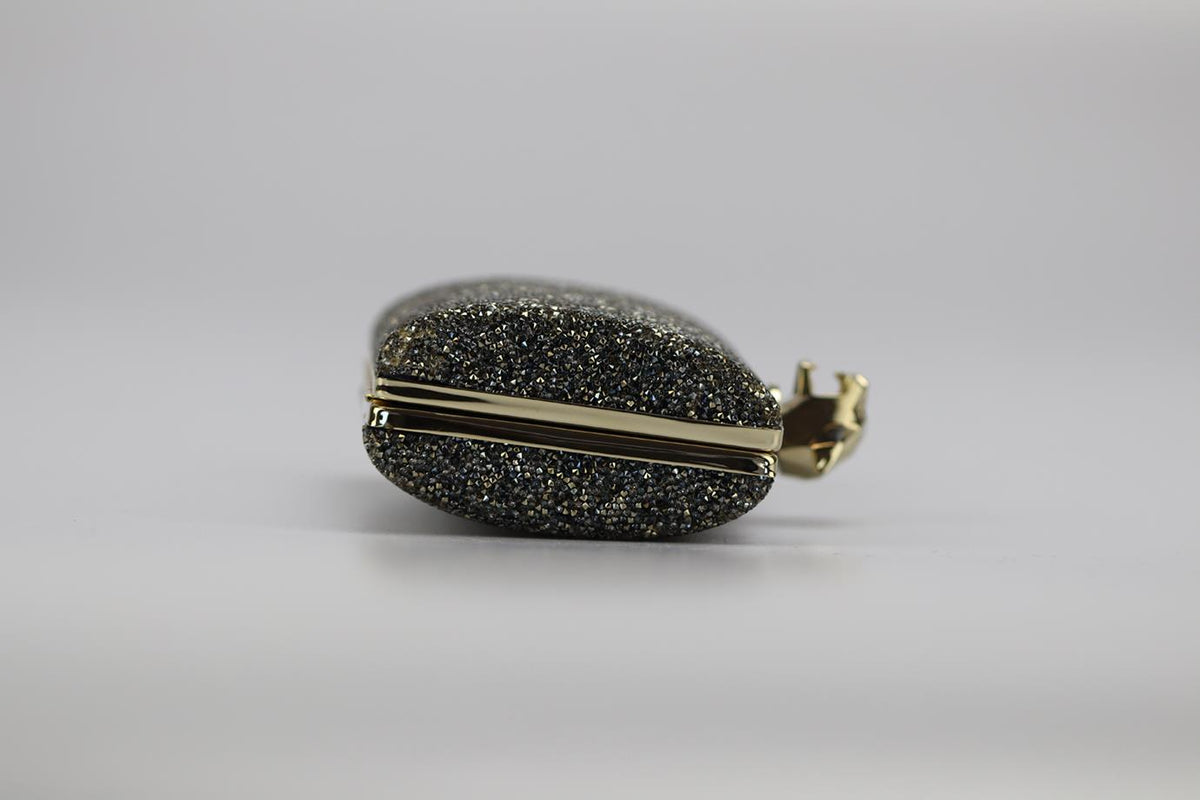 STARK CRYSTAL EMBELLISHED SUEDE AND SILVER TONE CLUTCH